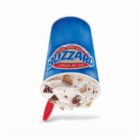 Reese'S Blizzard · REESE'S Peanut Butter Cups blended with creamy DQ vanilla soft serve to BLIZZARD perfection