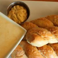 Soft Pretzels · Homemade fresh baked soft pretzel twists served with English spicy mustard and a truffle béc...
