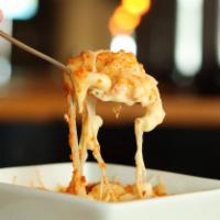 Mac & Cheese · Macaroni noodles tossed in our bechamel cheese sauce topped with a toasted white cheese blen...