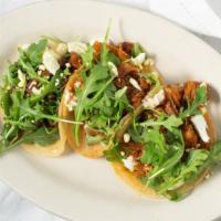 Pork Tacos(3) · A trio of street tacos filled with sauted pork tossed in a spicy Nashville sauce, topped wit...