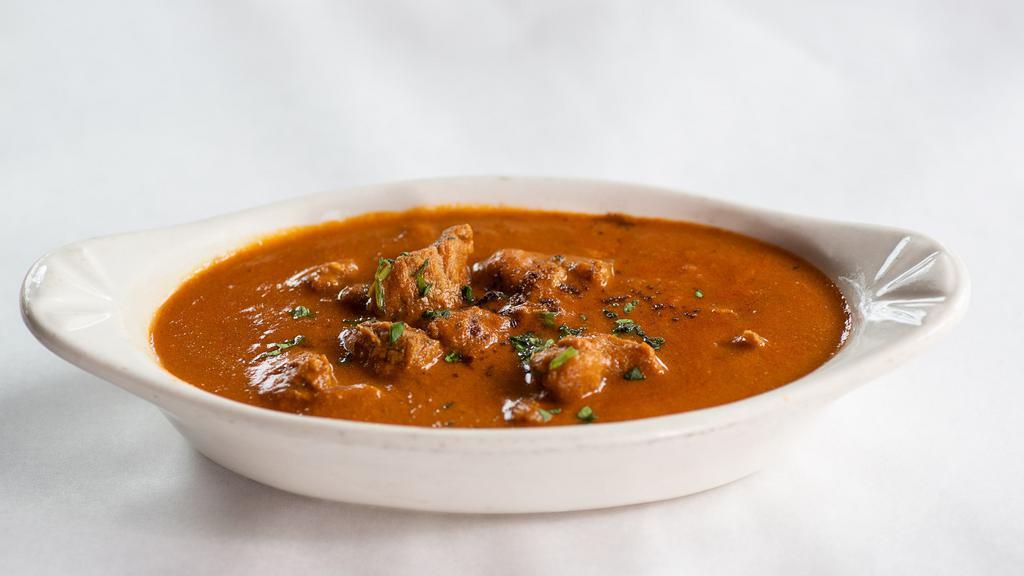 Chicken Curry · Chicken cubes cooked in a special blend of seasonings and curry sauce served with basmati rice.