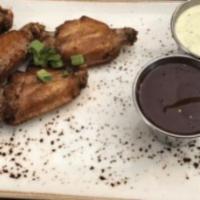 Smoky Chicken Wings · on side: sweet sriracha, jalapeño ranch dressing, house bbq sauce.