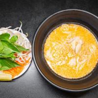Khao Poon · Rice vermicelli noodles in red curry soup base, coconut milk, served with a side of bean spr...