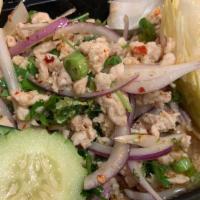 Larb Chicken (Lao Style)            · Lemongrass, mints, scallions, red onions, and cilantro in spicy lime sauce served on bed of ...