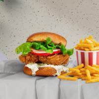 Classic Chicken Sandwich · Crispy fried chicken, lettuce, tomato, onion, and house mayo sauce. Served on a warm bun.