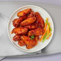 Hot Wings · Fresh chicken wings breaded, fried until golden brown, and tossed in hot sauce.