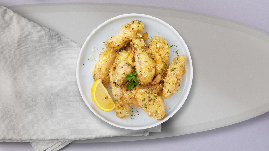 Garlic Parmesan Wings · Fresh chicken wings breaded, fried until golden brown, and tossed in lemon pepper sauce.