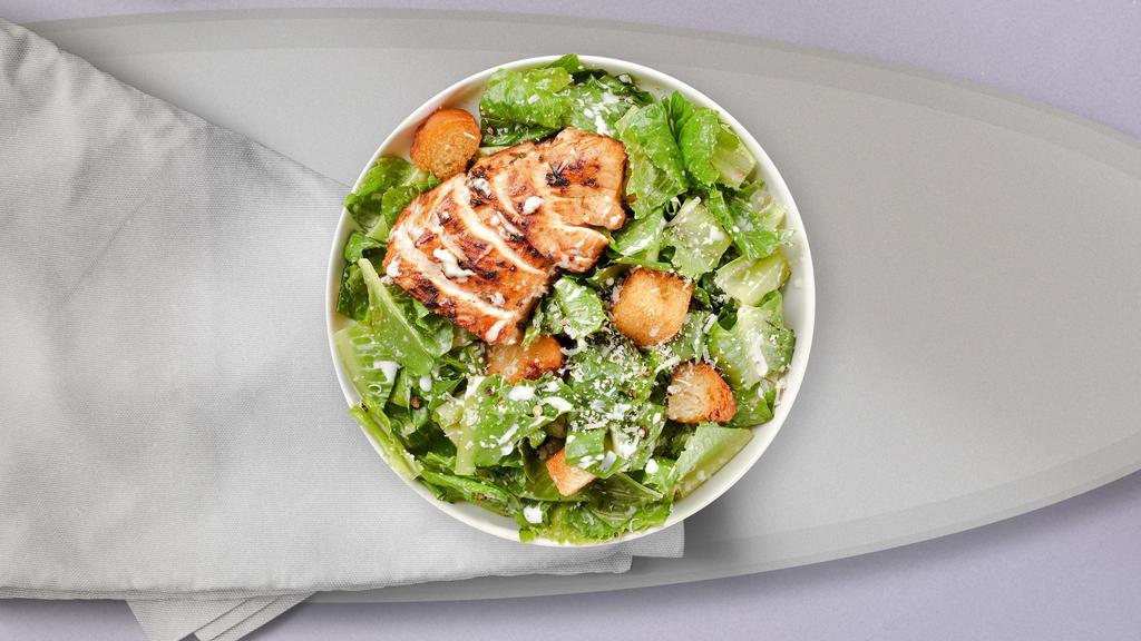 Chicken Caesar Salad · Romaine lettuce, grilled chicken, house croutons, and parmesan cheese tossed with caesar dressing.