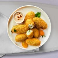 Jalapeno Poppers · (Vegetarian) Six pieces of fresh jalapenos coated in cream cheese and fried until golden bro...