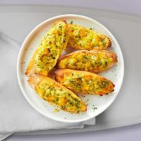 Garlic Bread With Cheese · (Vegetarian) Housemade bread toasted and garnished with butter, garlic, mozzarella cheese, a...