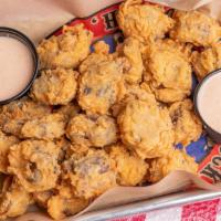 Brisket Bites Half · Our famous smoked prime brisket, cut into bite sized chunks and dipped in homemade batter, d...