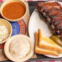 Full Rack Pork Rib Platter · Full rack St. Louis style ribs are rubbed with Riscky's Dust and smoked slowly over a wood f...