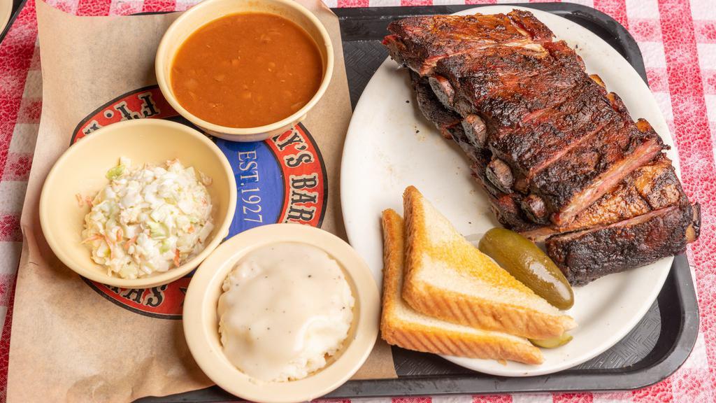 Full Rack Pork Rib Platter · Full rack St. Louis style ribs are rubbed with Riscky's Dust and smoked slowly over a wood fire until tender. Served with you choice of 3 sides.
