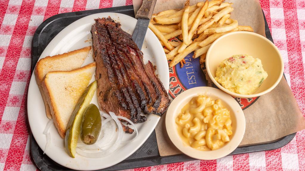 Sliced Brisket Platter · A prime cut of lean beef brisket, rubbed with Riscky's Dust and smoked slowly over a wood fire until tender. Served with your choice of three sides.