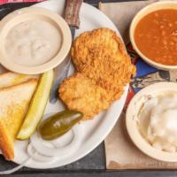 Chicken Fried Chicken · A seasoned chicken breast battered and deep fried, served with cream gravy on the side, and ...