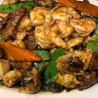 Triple Crown Dinner · Our customers all times favorite! Large shrimp,  chicken breast, flank steak, snow peas, car...
