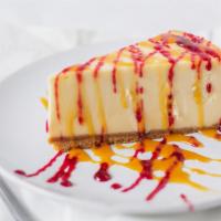 New York Cheesecake · Creamy cheesecake on a graham cracker crust. Comes with your choice of chocolate, caramel, r...