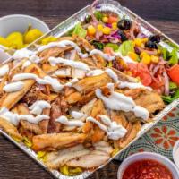 Chicken Shawarma Over Rice · Thin cuts of Chicken. 
Big Bite Rice. 
Salad (lettuce, tomato, sweet corn, black olives, and...