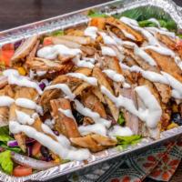 Chicken Shawarma Over Salad · Thin cuts of Chicken.
Salad (lettuce, tomato, sweet corn, black olives and carrots)