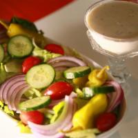 Garden Salad · Romaine Lettuce with Banana Peppers, Red Onion, Green Peppers, & Tomatoes served with Chef's...