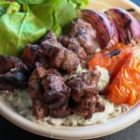 Lamb Kabob Plate · Basmati Saffron Rice | Grilled Lamb | Lettuce | Tomatoes | Pickles | Onions | Tzatziki Sauce...