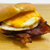 The Egg Sandwich · Cheddar cheese, bacon, house-made spicy ketchup.