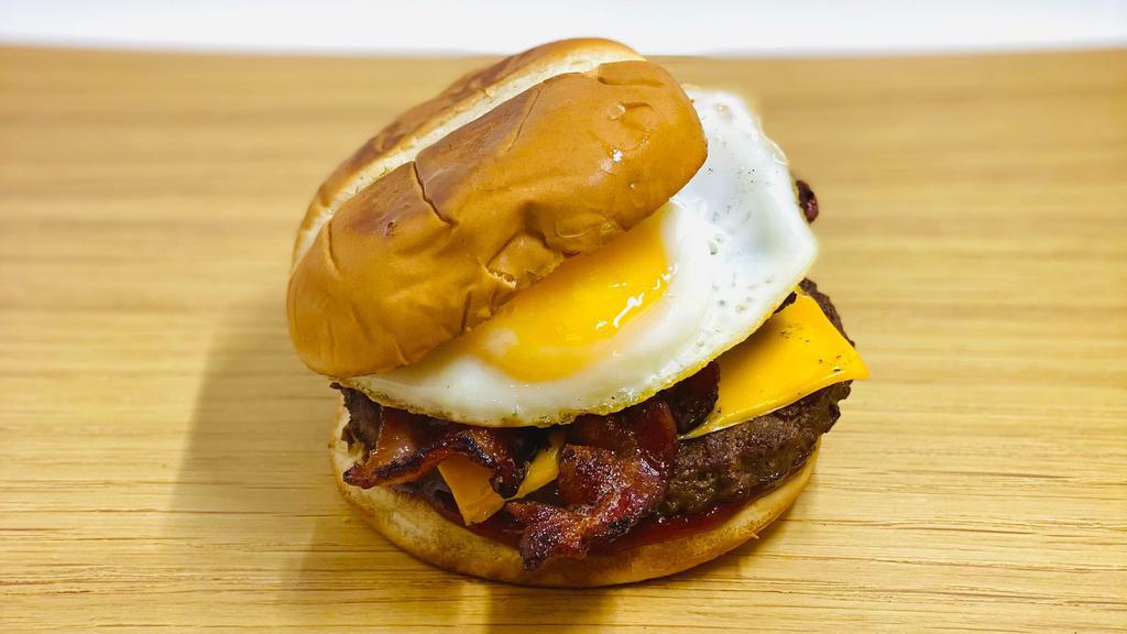 Breakfast Burger · Burger patty, cheddar cheese, bacon, fried egg, house-made spicy ketchup.