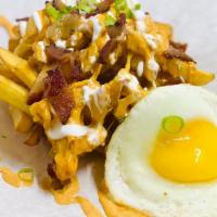 Breakfast Loaded Fries · French fries, Cheddar cheese, bacon,  sour cream, chipotle mayo, fried egg on top.