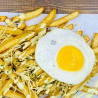 Truffle Breakfast Fries · French fries, parmesan cheese, truffle oil, fried egg on top.