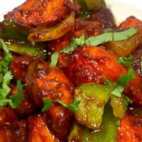 Chicken Chilli · Chicken sautéed with bell peppers, tomatoes, and tangy sauce.