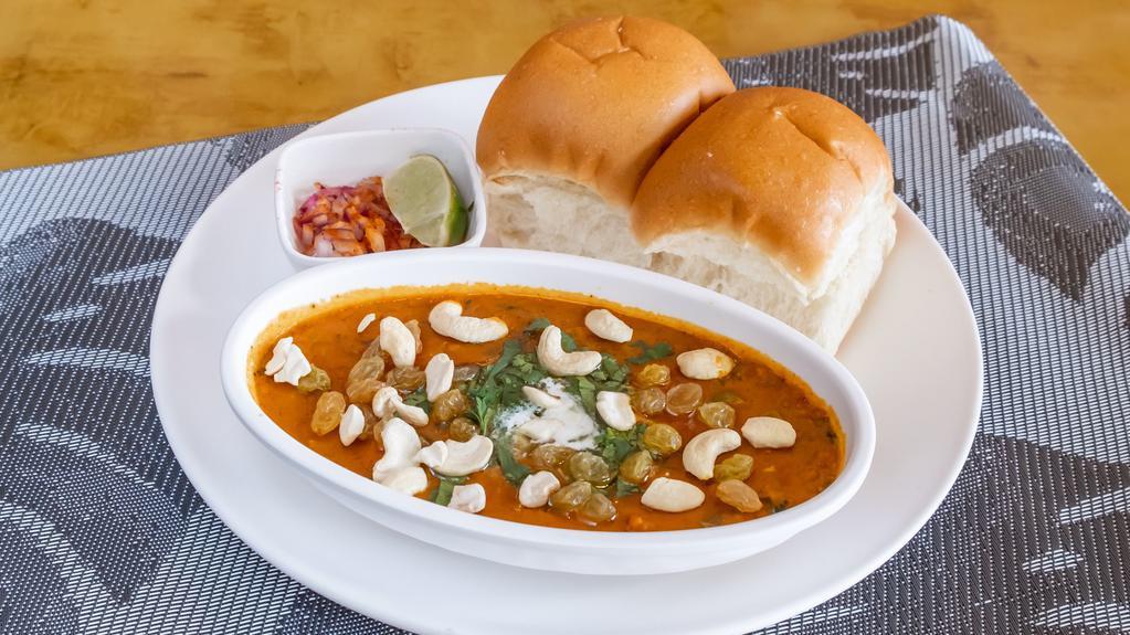 Honest Sp. Bhaji Pav · Our signature spiced vegetable and potato mash with cashews and raisins served with warm buttered pav.