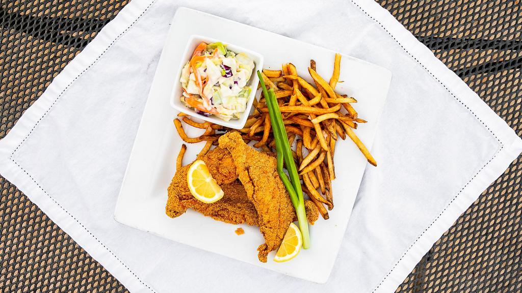 Fried Catfish · Three catfish filets coated with corn-meal, with sides of fries, coleslaw, and a side of tartar.