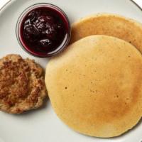Lemon Poppy Seed Pancakes With Sausage And Berry Compote · This sweet and savory breakfast features our lemon poppy seed pancakes topped with house-mad...
