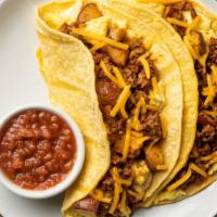 Chorizo And Potatoes Breakfast Tacos With Salsa Roja · We’re staying true to our Texas roots with these hearty breakfast tacos! Stuffed inside two ...