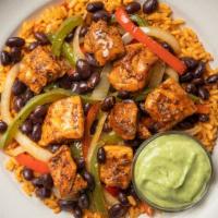 Chicken Burrito Bowl With Avocado Salsa · A southwestern classic! We took roasted chicken thigh, veggies, organic brown rice, added ou...