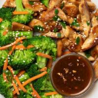 Stir-Fry Chicken And Broccoli With Garlic Sauce · Garlic lovers, unite! Our Snap take on Stir-Fry Chicken includes pan-seared chicken topped w...