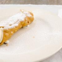 Cannoli · Pastry Tube Filled with Sweet Ricotta Cream, Chocolate, and Powdered Sugar.