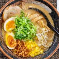 Miso Ramen · A rich pork and chicken broth with a light garlic and soy bean base. Toppings: A slice of gr...