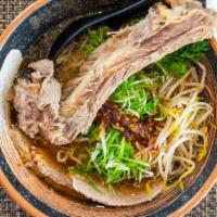 Spicy Beef Ramen · A hearty beef broth with a shoyu base. Toppings: Daikon radish, scallions, cilantro, braised...