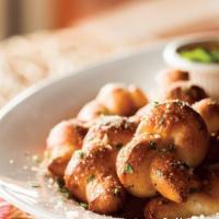 Homemade Garlic Knots · (1,020 cal). Hand-knotted pizza dough tossed with Sicilian extra-virgin olive oil, fresh gar...