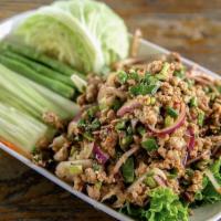 Larb Gai Salad · Thai Minced Chicken Salad. Spicy salad mixed ground chicken, mint, basil and red onions dres...