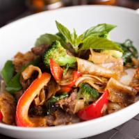 Pad Kee Mow · Minced chicken, tomatoes, carrots, onions, bell peppers, and fresh basil stir fried with big...