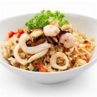 Seafood Fried Rice · Stir fried rice with assorted seafood( shrimps, scallop, mussel, fried catfish, squid)  onio...