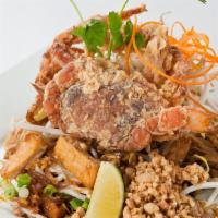 Soft Shell Crab Woonsen · Glass noodle stir fried with crab meat, bean sprout, and scallion and topped with tempura so...