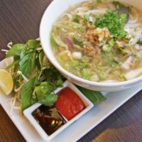 Vietnamese Noodle Soup · A fragrant clear broth noodle soup with onions, scallions, and a side of bean-sprout and bas...
