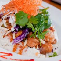 Almond Siracha Chicken · Tempura Chicken wok tossed in spicy Siracha sauce with onions, scallions, and almonds over J...