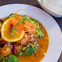 Orange Chicken · Lightly battered chicken in a sweet and tangy homemade orange sauce served with fresh steame...