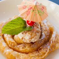 Cinnamon Pastry Swirl · Pastry swirl served with a scoop of cinnamon ice cream.