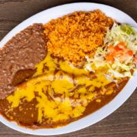 Super Enchiladas Plate · (Green or Red)
Cheese, Beef or Chicken
Rice, Beans, Salad & 2 Super Tortillas