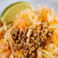 Papaya Salad · Papaya mix with dried crush shrimps, tomatoes, basil, cabbage, and lime.